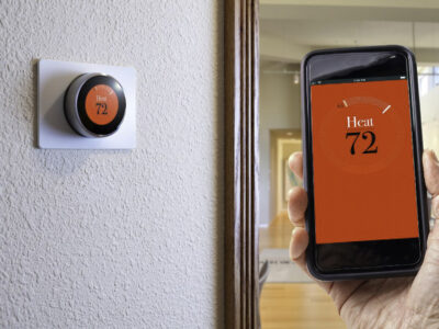 A smart thermostat is one that you can control straight from your phone. This means you can control your heating and air conditioning temperature from anywhere.